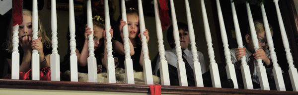 Children Peeking Through Banisters