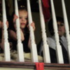 Children Peeking Through Banisters